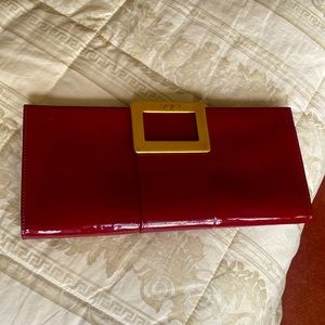 ROGER VIVIER Burgundy color patent leather clutch.